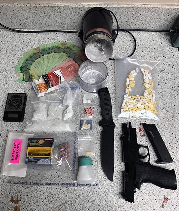 Seized drugs and weapons from an Innisfail RCMP bust on Sept. 20.