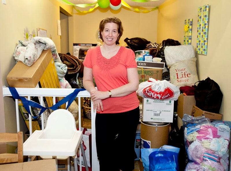 Donna Mirus at the Olds Sandbox with donations for people affected by the Slave Lake wildfire.