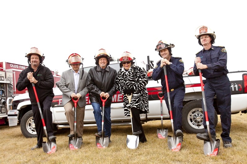 From left: Contractor Mike Helmer, Olds CAO Norm McInnis, Reeve Bruce Beattie, Mayor Judy Dahl, Olds Fire Chief Lorne Thompson and Deputy Fire Chief Brian Powell break ground 