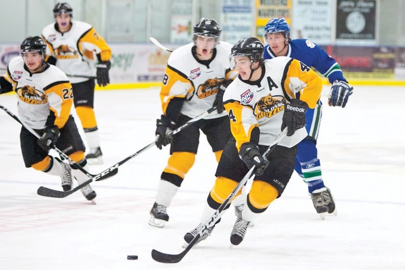 Olds Grizzlys player Casey Rogers handles the puck during the Grizzlys game against the Calgary Canucks at the Olds Sportsplex last Friday.