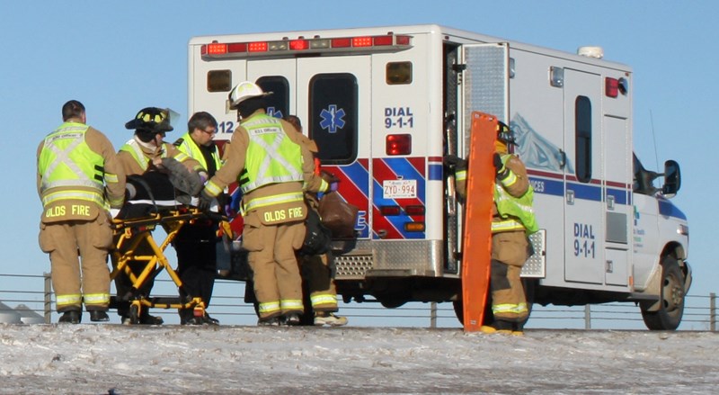 The chief of the Olds Fire Department said more direct communication between firefighters and ambulance crews is needed in emergency situations.