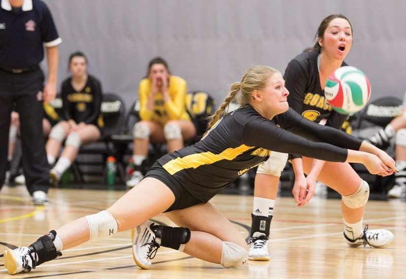 Olds College Broncos player Kasandra Menzies dives for the ball during the Broncos&#8217; game against the Grande Prairie Wolves at the Ralph Klein Centre on Jan. 18. CLICK