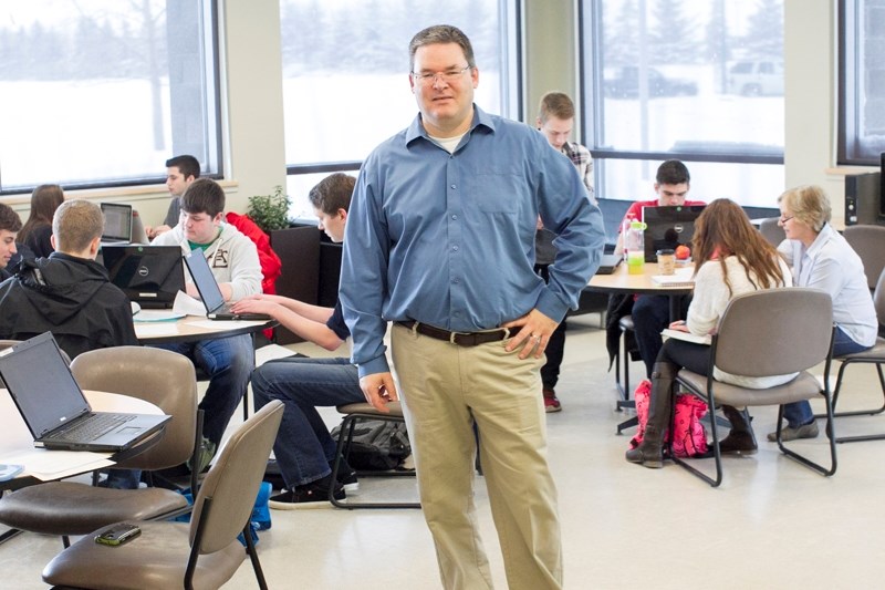 Olds High School teacher Bradley Clapp, pictured with his Grade 12 academic team program class at the school on March 31, is a semi-finalist for Alberta Education&#8217;s