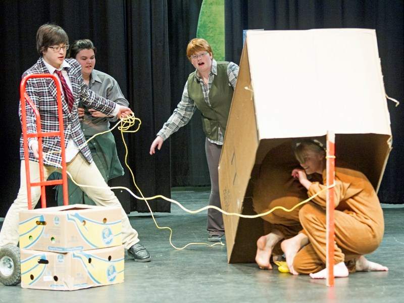 Olds High School drama students (from left) Everest Hughes, as the mayor, Brooklyn Lambert and Kaitlynne Wilson, as zoo employees, trap Reanne, left, and Emma Schaber as a