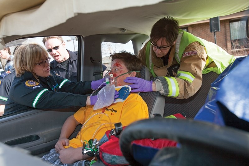 Olds High School student Spencer Dagg, portraying a victim in a collision scenario put on by the P.A.R.T.Y. (Prevent Alcohol and Risk-related Trauma in Youth) program and