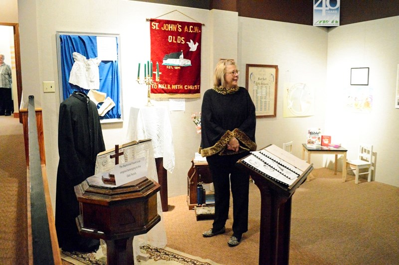 Olds mayor Judy Dahl checks out a special exhibit celebrating the 120th anniversary of Olds&#8217; St. John&#8217;s Anglican Church at the Mountain View Museum and Archives