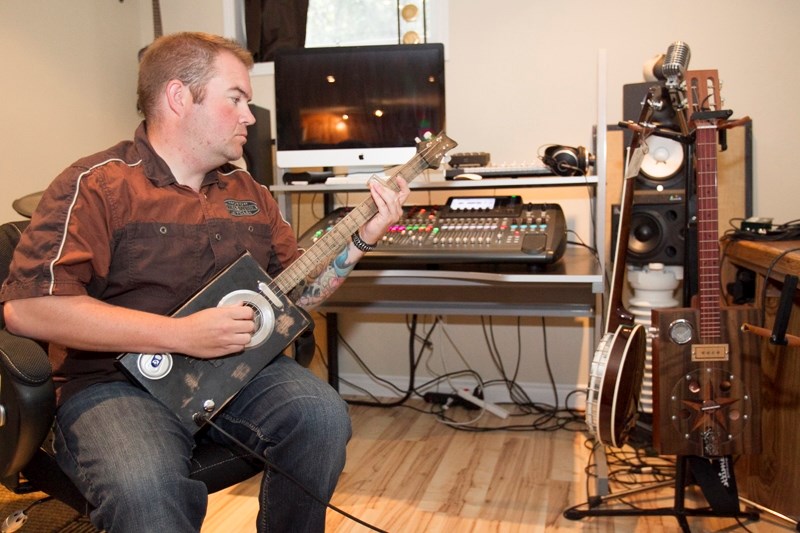 Ben Chrusch of Olds has built guitars using cigar boxes for three years.