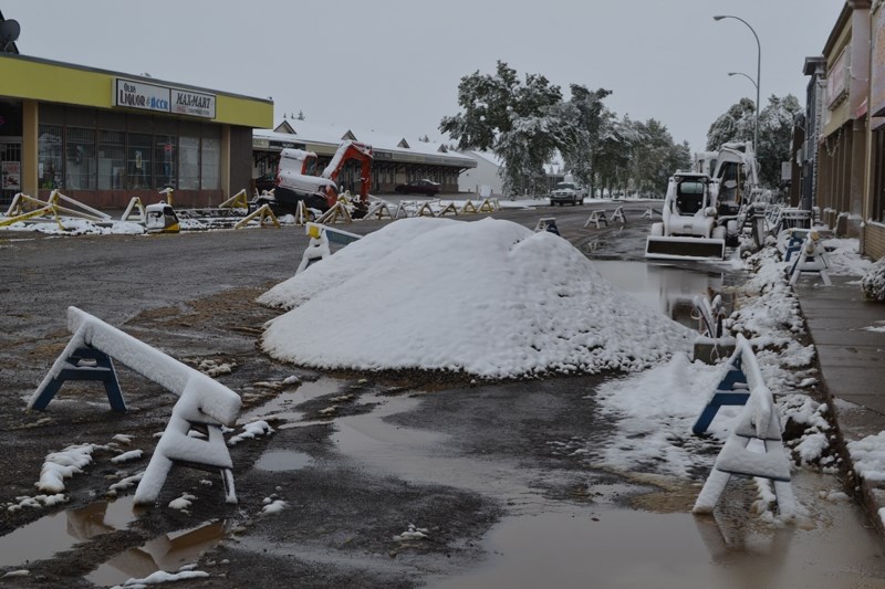 Construction equipment lay dormant Wednesday morning after Tuesday night&#8217;s snow fall.