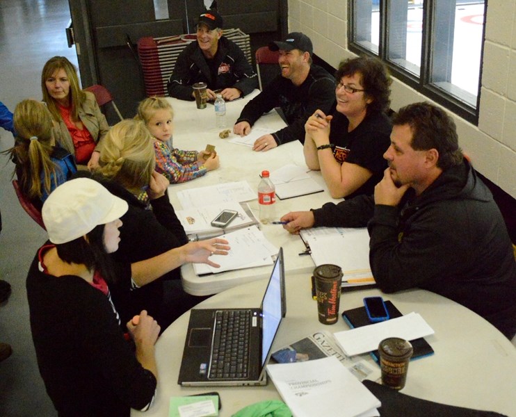 Members of a committee hoping to land the 2015 peewee AA major provincials hockey tournament meet at the Olds Sportsplex on Oct. 23.