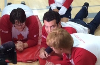 CBC TV star Rick Mercer meets with Special Olympics athletes during a training camp.