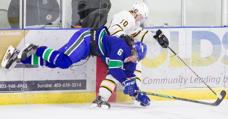 Olds Grizzlys player Josh Zablocki collides with a Calgary Canucks player on the ice during the teams&#8217; game at the Olds Sportsplex on Nov. 14. The Grizzlys won the game 