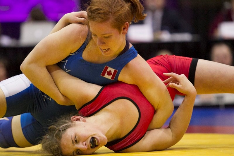 Amber Maschke, left, competes against Krystin Paquette during the Men&#8217;s &#038; Women&#8217;s Freestyle Pool Tournament section of the Canadian Wrestling Team Trials at