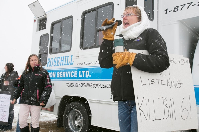 Shelley Currier speaks to a crowd assembled at a rally across from the Cow Palace before the Bill 6 information session.