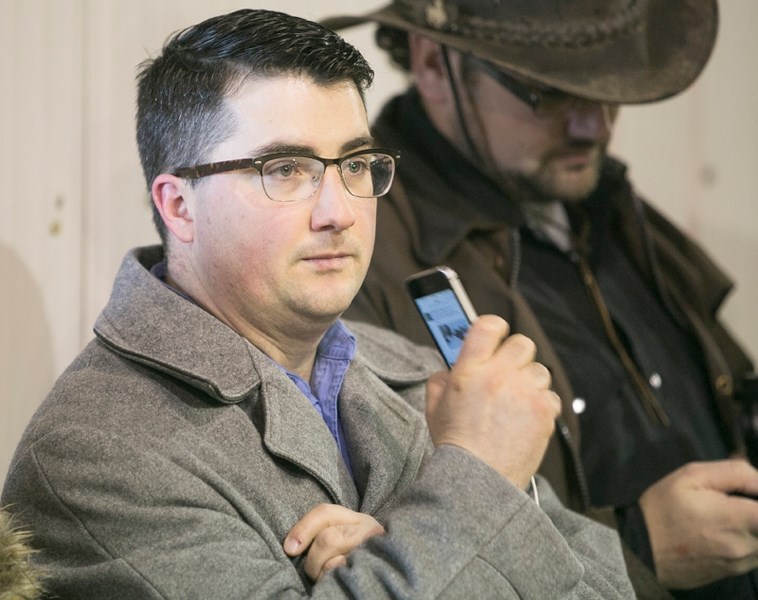 Wildrose MLA Nathan Cooper takes in the Bill 6 information session Wednesday at the Cow Palace.