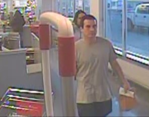 This surveillance photo shows the two suspects leaving Shoppers Drug Mart in Olds.