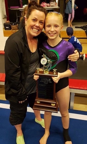 Amgas Athlete of the Year Soulayah Petersen poses with Olds Gymnastics Club head coach Michelle Jaffray.