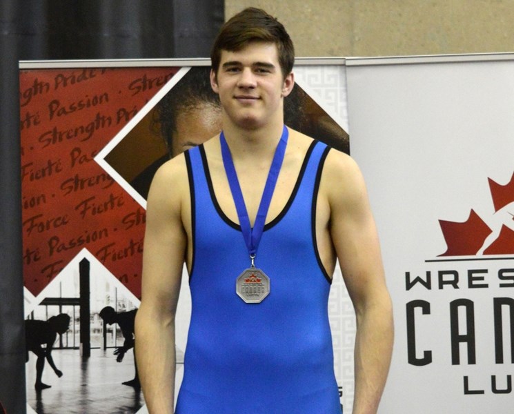 Olds wrestler Kevin Waldron on the podium with his silver medal at the 2016 ASICS Cadet/Juvenile Canadian Wrestling Championships in April.