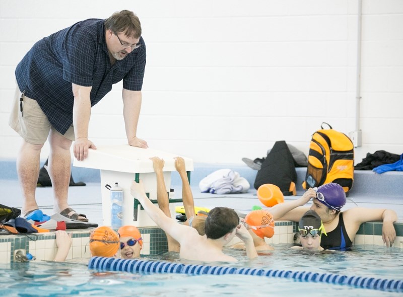 Three-time Olympic medallist Tom Ponting coaches members of the Olds Rapids Swim Club at the Olds Aquatic Centre.