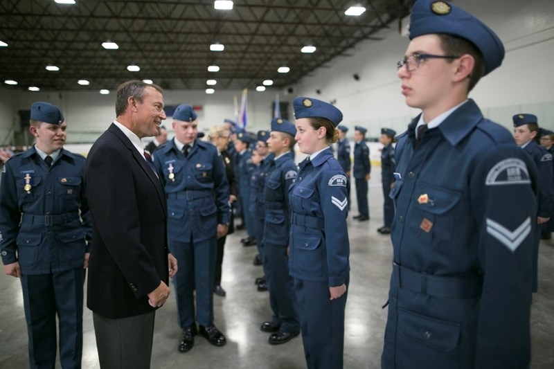 Ward Mackenzie, reviewing officer for the ceremony, inspects members of the squadron.