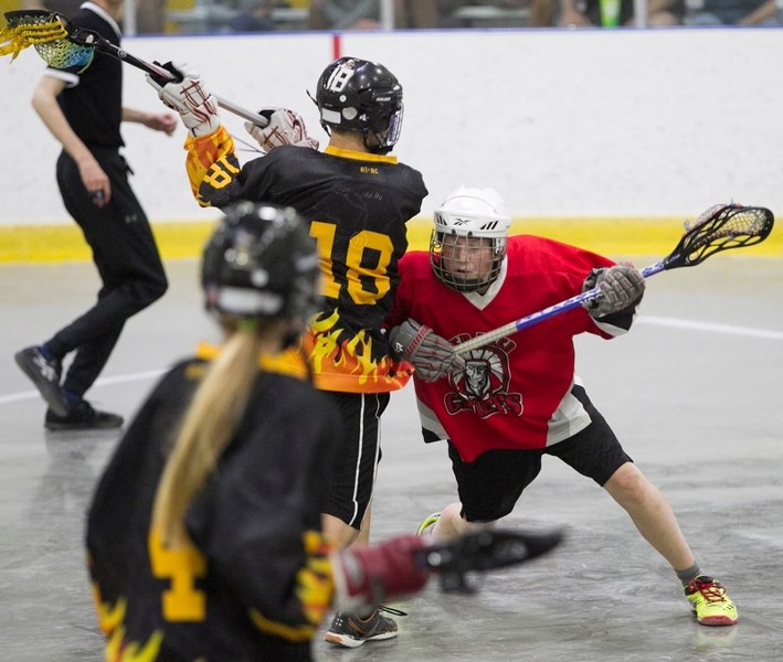 Red Deer Chiefs player Brock Smith checks an Olds player during the teams&#8217; game at the Olds Sportsplex.&lt;br /&gt;Noel West/MVP Staff&lt;br /&gt;Red Deer Chiefs player 