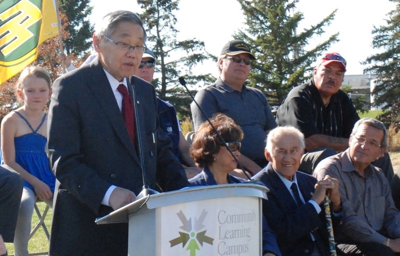 A photo of Normie Kwong speaking at the official naming ceremony of Normie Kwong Park at the Community Learning Campus in Olds in 2010, by Olds College under a Creative