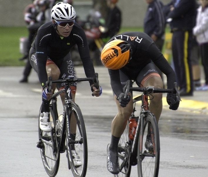 One cyclist looks back at a competitor as they race through Olds Sept. 2 during the Tour of Alberta.