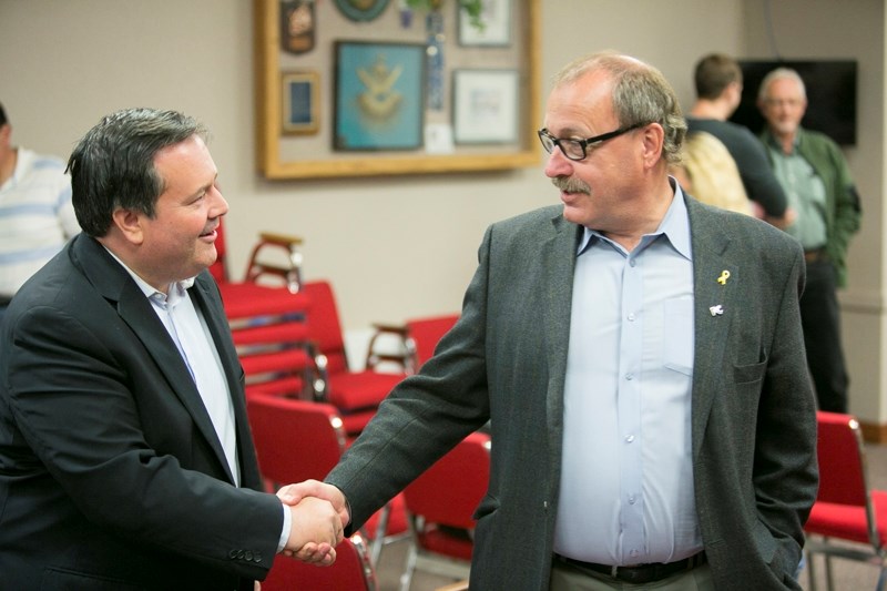 GRIP ON POWER &#8211;Alberta Progressive Conservative (PC) leadership candidate Jason Kenney, left, speaks with interim PC leader Ric McIver during the Olds-Didsbury-Three