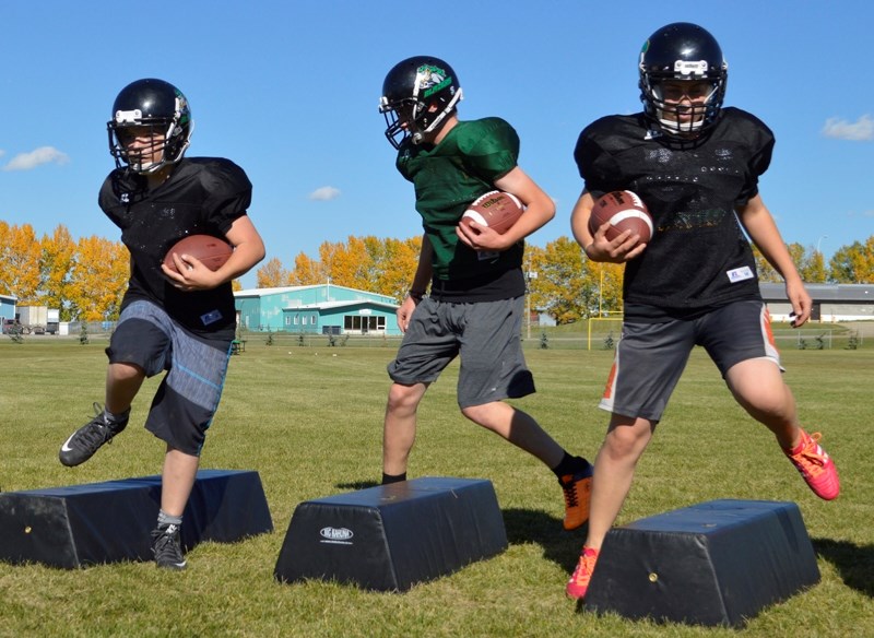 Football players at Bowden Grandview School perform an agility drill in practice on Sept. 15. The Blazers are starting their second season.