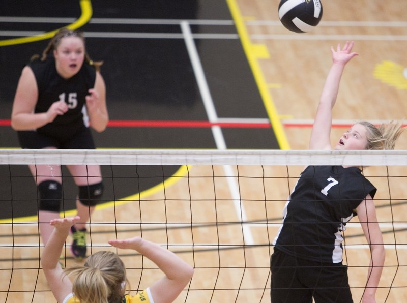 Olds Jr. A volleyball player Kaliese Bullock spikes the ball during the Spartans&#8217; game against the Cremona Cougars at Olds High School on Oct. 15. The game was part of