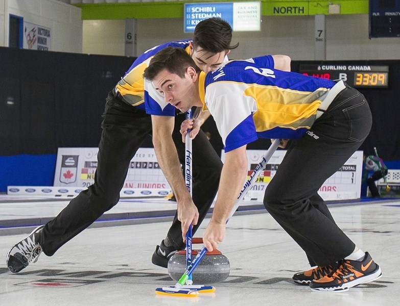 Kurtis Goller and teammate Nick Rabl sweep a rock during the Junior Men&#8217;s National Championships in Esquimalt, B.C. late last month.