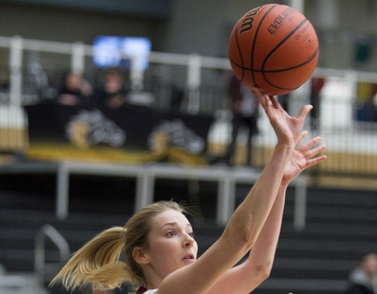 Olds College Broncos basketball player Sierra Harty attempts a shot against Red Deer College at the Ralph Klein Centre on Feb. 9.