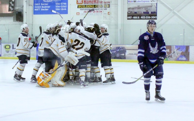 The Olds Grizzlys celebrate their Game 3 win that clinched the playoff series against the second-ranked Canmore Eagles on home ice Sunday, March 12.