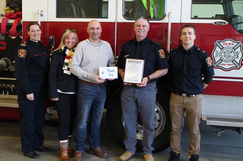 Regional Municipality of Wood Buffalo deputy fire chief of training &#038; recruitment Cranley Ryan, third from left, and his wife Melonie Matthews-Ryan, second from left,