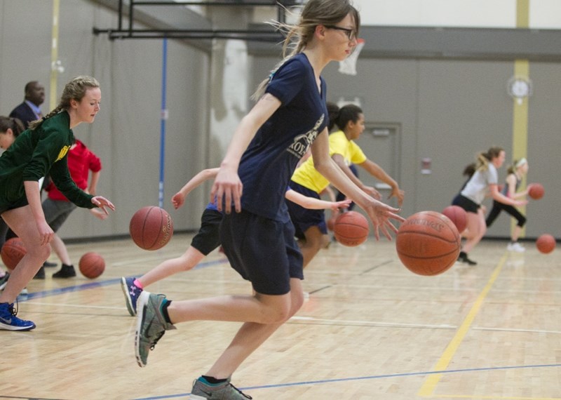 Olds Koinonia Christian School Grade 8 student Kat Burns takes part in a drill during a Central Alberta Basketball Club tryout at Hugh Sutherland School on March 30.