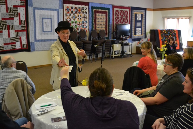 Olds playwright Mary Hays acts out a scene from her upcoming play: See Olds First, which will be performed June 17 in Olds. Here, former mayor Billy Dean persuades members of 