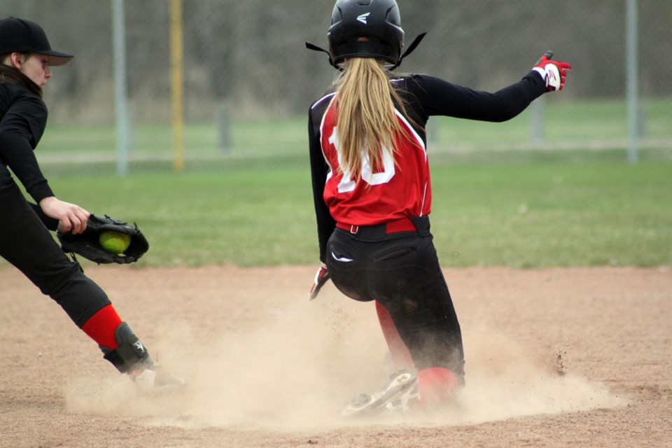 Jaeden Cameron (10) slides into second during the Olds Pistols 21-12 win over the Elnora Eagles in the battle for bronze during the U-16 Season Opener at O.R. Hedges Park on