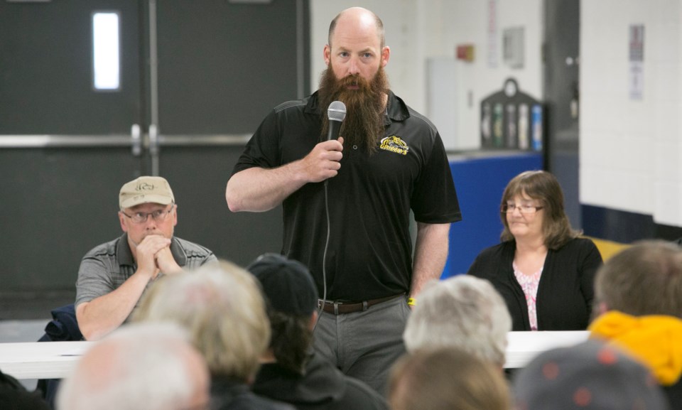 Grizzlys head coach Dana Lattery addresses those in attendance during the meeting.