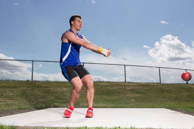 Andreas Troschke practises the hammer throw at a training area next to Olds High School on June 27.