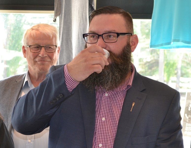 Municipal Affairs Minister Shaye Anderson samples a beer at the Olds College brewery.