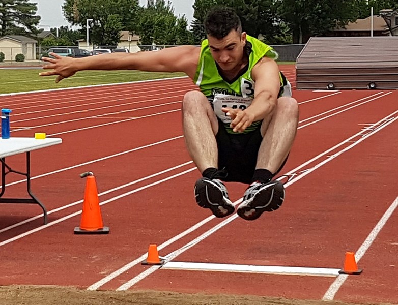 Devyn Renzetti competes in the long jump during the Alberta Special Olympics Summer Games in Medicine Hat.