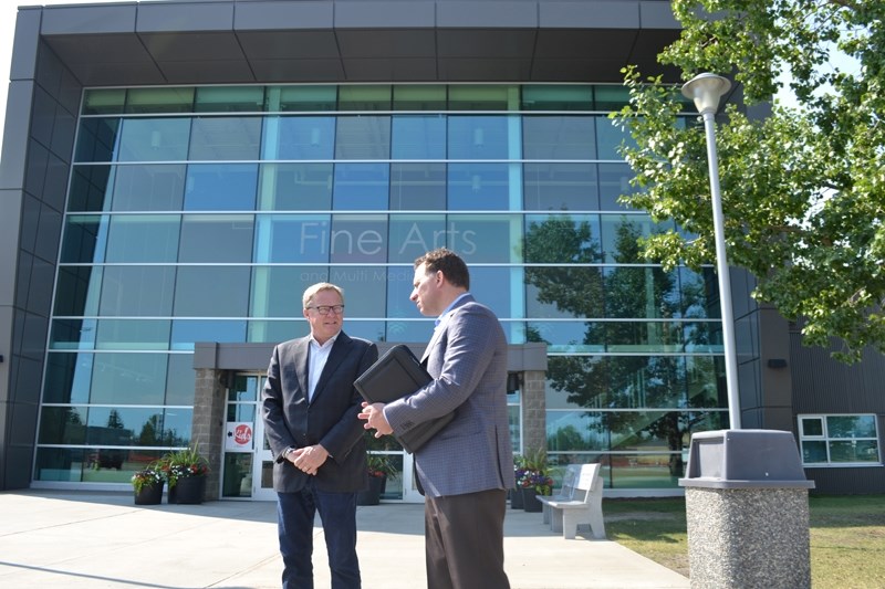 Outside the Fine Arts and Multi-Media Centre, Education Minister David Eggen, left, and Olds College president Stuart Cullum discuss ways in which the provincial government