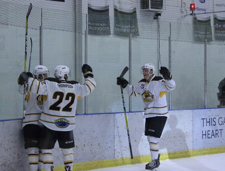 The Grizzlys&#8217; lead scorer Tyr Thompson (22) celebrates a goal during the team&#8217;s playoff series last season. Thompson is looking for a trade after a chaotic change 