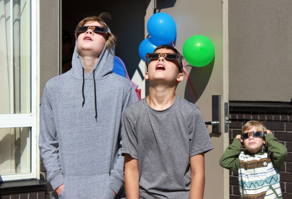 Brothers Domenic (13) left, and Logan Vaughan (11), centre, from Mount Forest, Ontario, happened to be in town on the right day to visit their father, and caught a glimpse of 