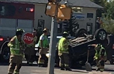 Firefighters clean up the scene of a crash that occurred at the intersection of HIghway 27 and 57th Avenue at about 12:50 p.m. on Labour Day.