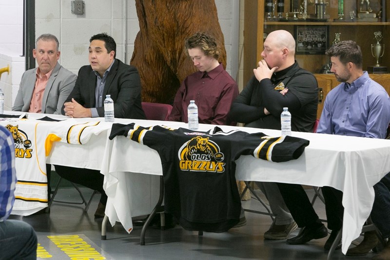 From left, Jeff Atkinson, head coach Adam Redmond, team captain Chase Olsen, assistant coach Blake Wildeman and associate coach Joe Murphy field questions during a news