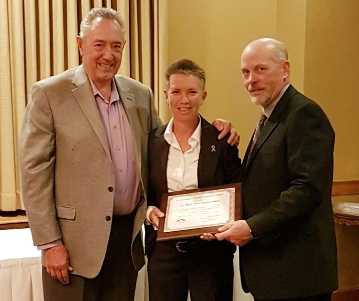 Olds High School athletic director Wanda Vandervelden was presented with the Wink Willox Award of Merit by the Canadian Basketball Officials Association for her contributions 