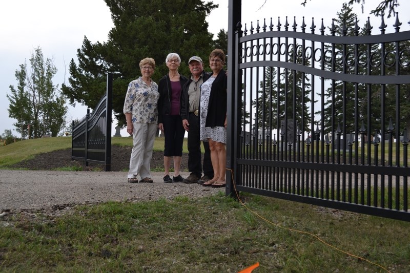 From left, Bowden and District Cemetery Association treasurer Marg Westman, chair Shirley Adam, council rep Wayne Milaney and secretary Sandy Gamble stand by the entrance to