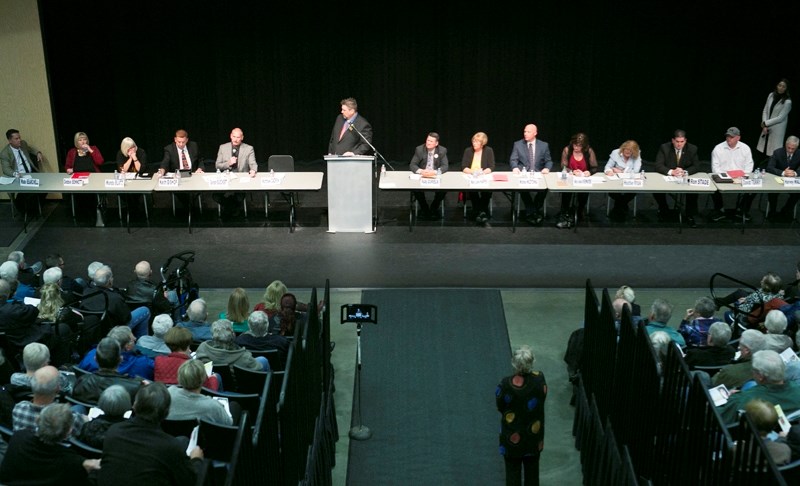 Olds councillor candidates and mayor-elect Mike Muzychka answer questions at an election forum at the TransCanada Theatre on Oct. 3.