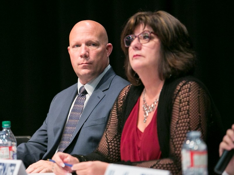 Mayor-elect Mike Muzychka watches as incumbent council candidate Mary Anne Overwater gets ready to respond to a question during the Oct. 3 election forum at the TransCanada