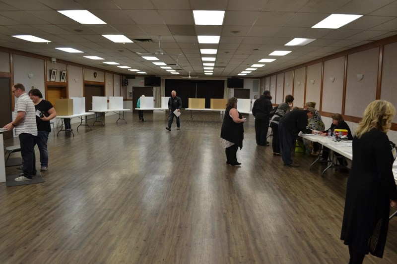 Residents vote &#8212; or register to vote &#8212; in the Olds Legion Hall, the site where polling stations for the Olds civic election were located.